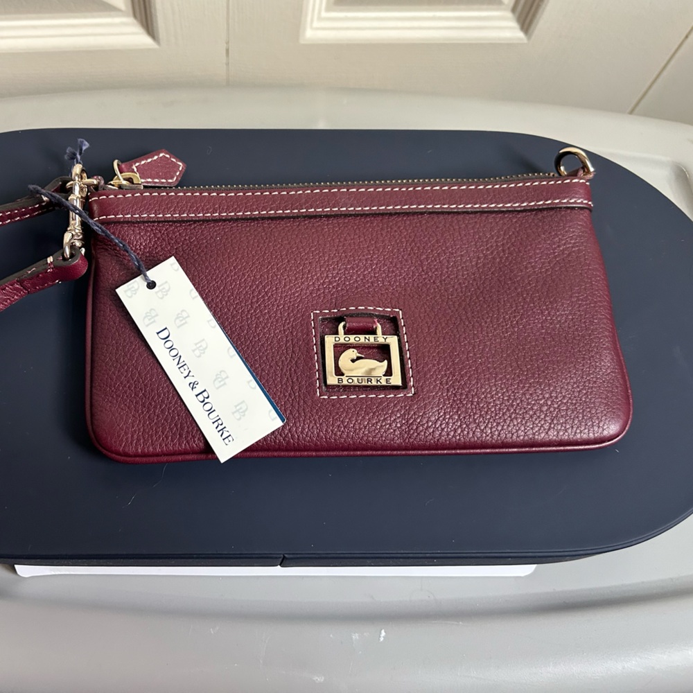 NWT dark red Dooney and Bourke wallet in excellent condition